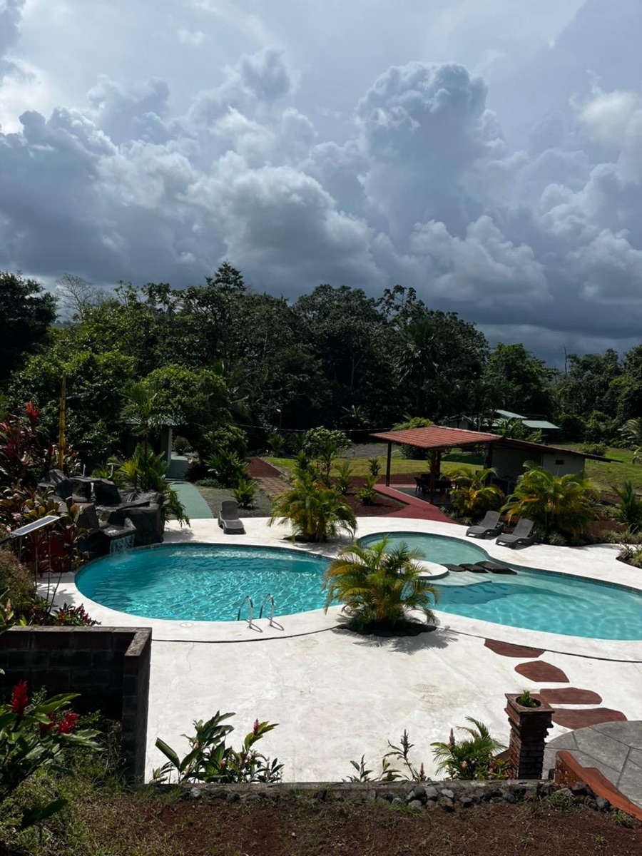 Pool and rancho at Hotel Confort Arenal